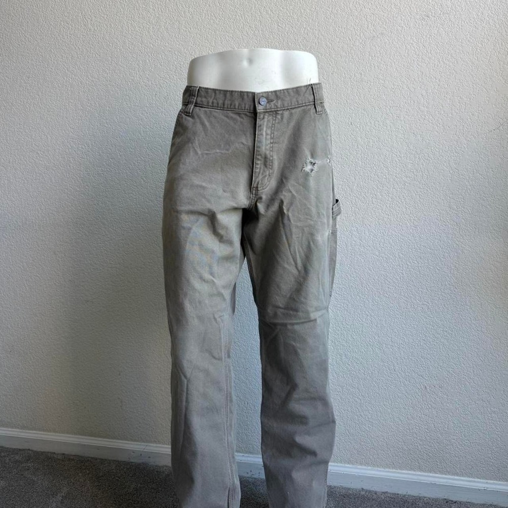 Tan Carhartt carpenter pants.